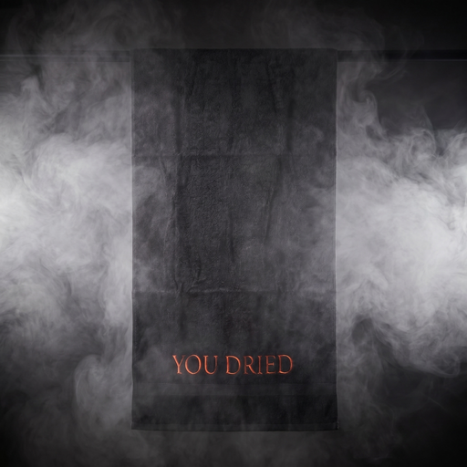 Black towel with embroidered "YOU DRIED" in red lettering - main view